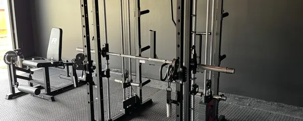 Power rack and functional trainer assembled in a home gym