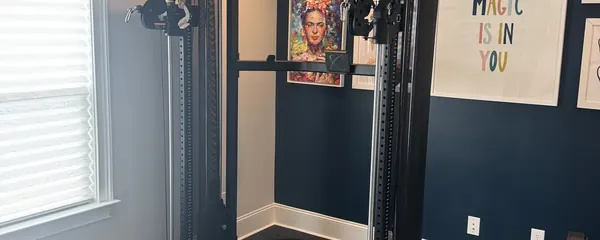 Squat rack assembled against a painted feature wall