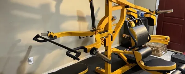 Plate-loaded home gym built in a basement room