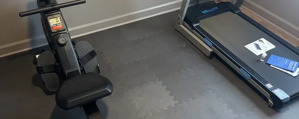 Rowing machine and treadmill set up together