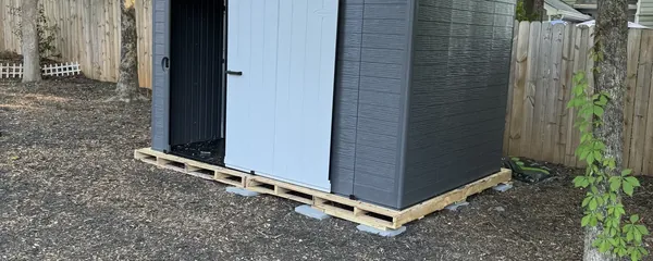 Storage shed built and set on a pad