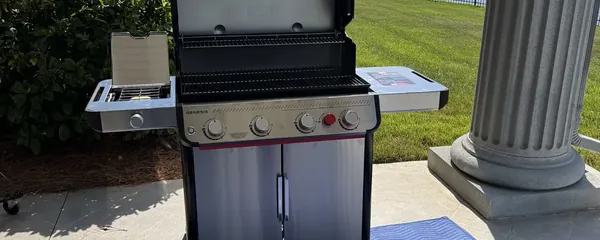 Gas grill assembled on a lakeside terrace