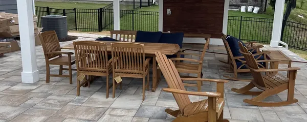 Patio dining set assembled under a porch