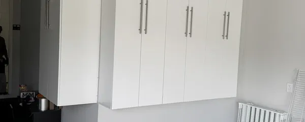 Wall of garage cabinets installed