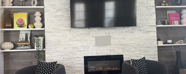 Television mounted between built-in shelving