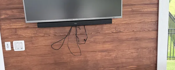 Television mounted on a wood accent wall