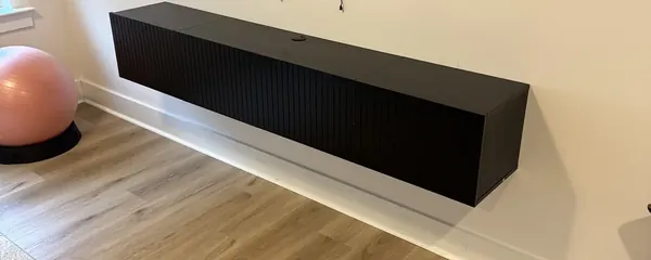 Television and floating console mounted together